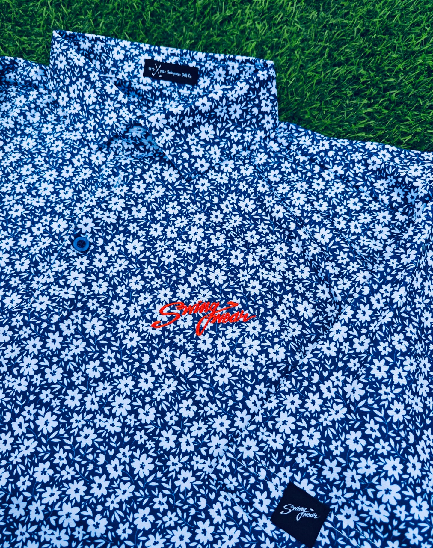 blue and white floral swingwear golf polo