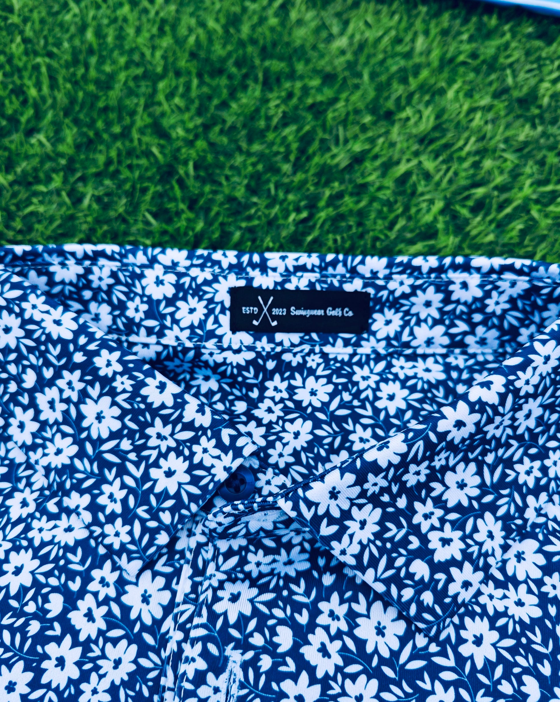 blue and white floral golf polo collar