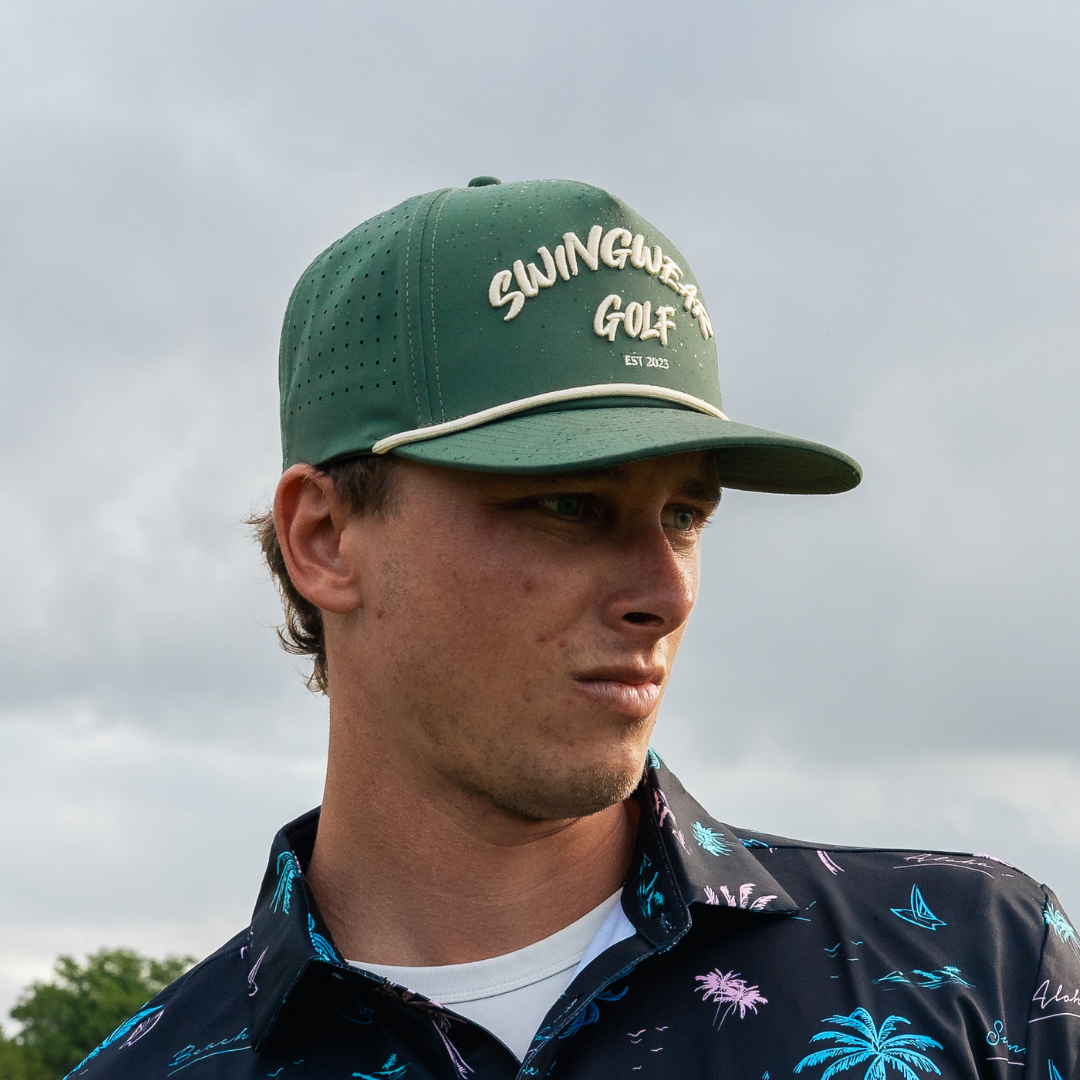 man with green golf hat