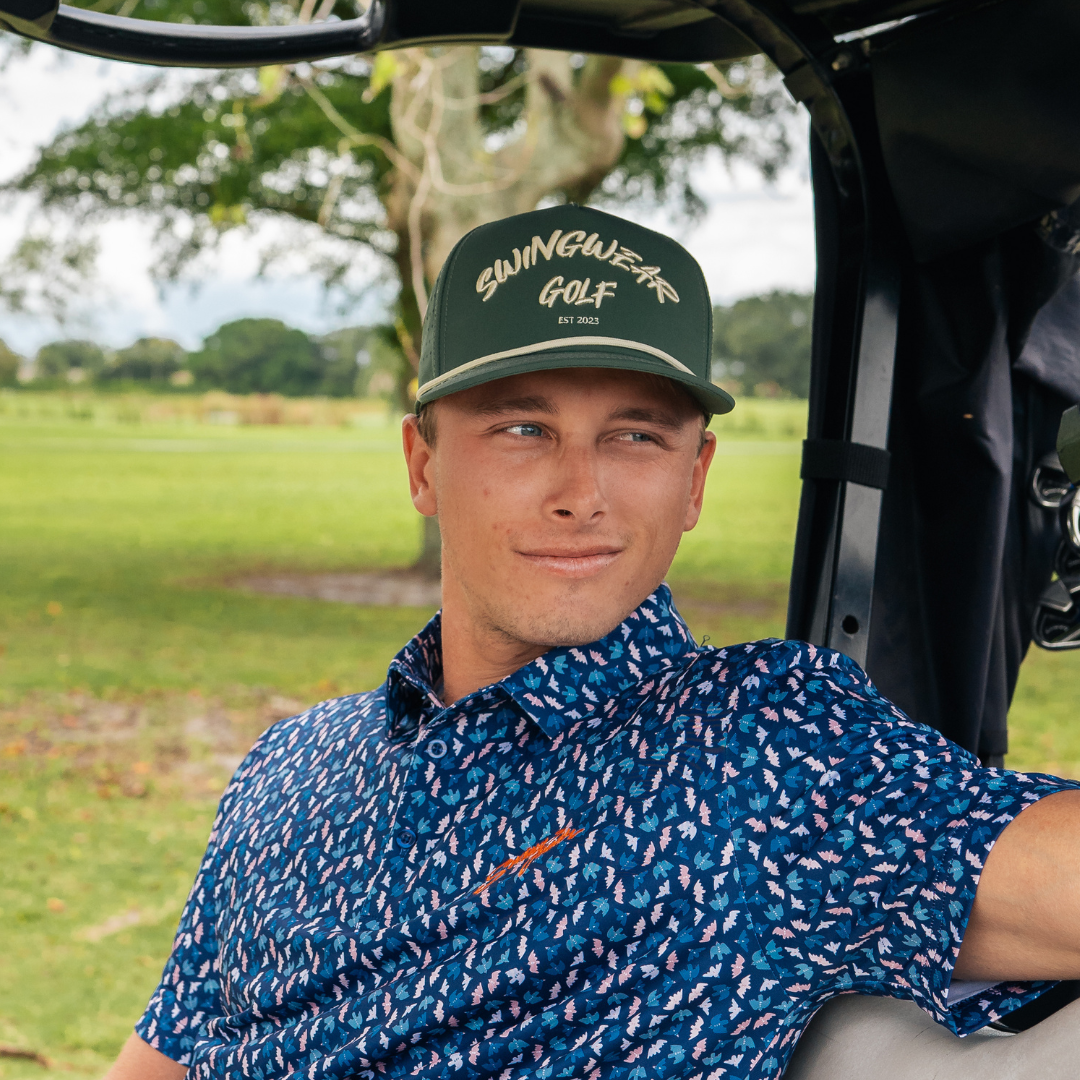 man wearing green swingwear golf hat