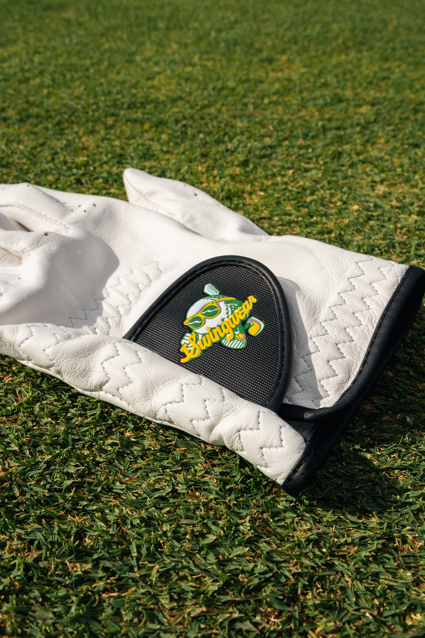 swingwear golf gloves on grass